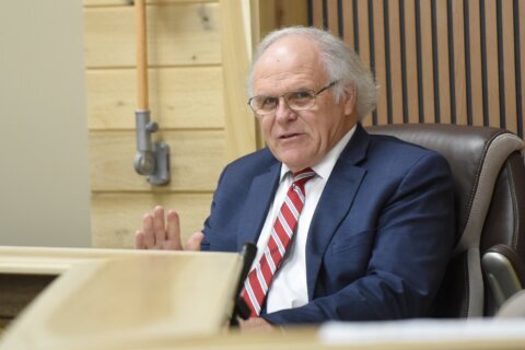 A council meeting is called in a small Georgia town whose mayor fired the entire police department