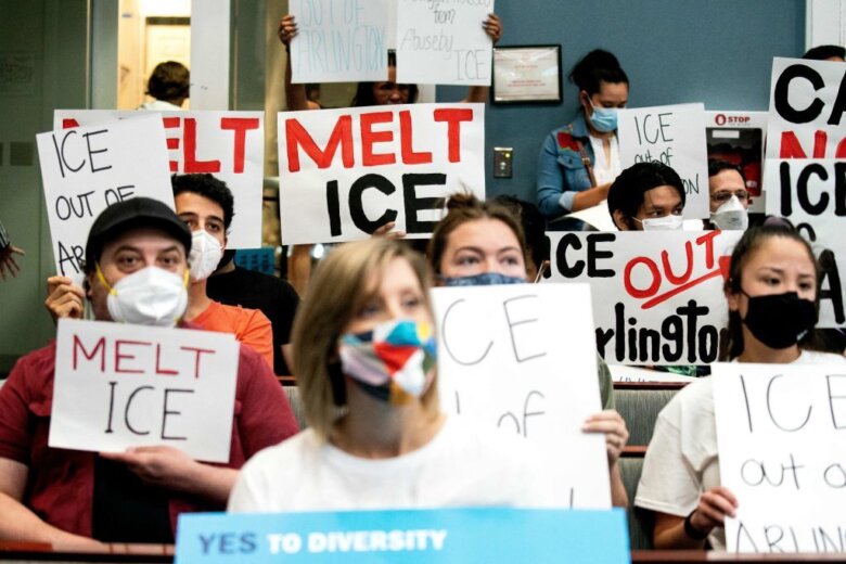 Demonstrators with La ColectiVA protest during the Arlington County Board meeting