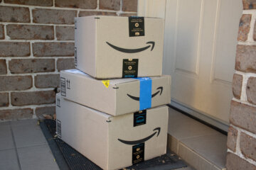 packages stacked on stoop
