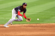 shortstop fields a baseball