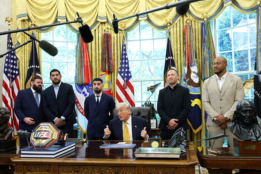 U.S. President Donald Trump speaks to the media as he meets with UFC fighters (L-R) Alex Pereira, Ilia Topuria, Justin Gaethje and Ciryl Gane in the Oval Office