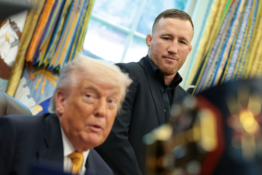 UFC fighter Justin Gaethje listens as U.S. President Donald Trump speaks