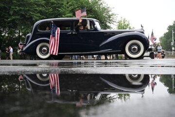A vintage car takes part in the National Memorial Day Parade on Constitution Avenue in Washington, DC, on May 25, 2026. (Photo by Alex WROBLEWSKI / AFP via Getty Images)