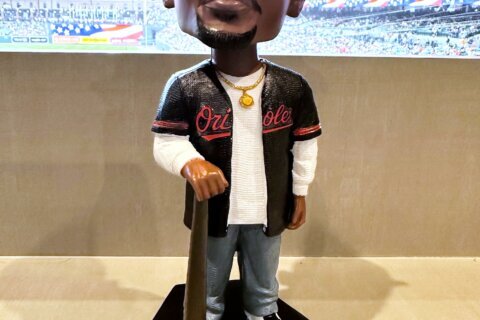Orioles hold Tupac Skakur bobblehead promotion, and his sister throws out the ceremonial first pitch