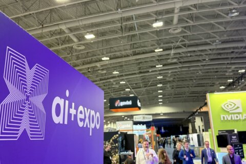 wide view of ai expo in convention center with ai expo sign to the left