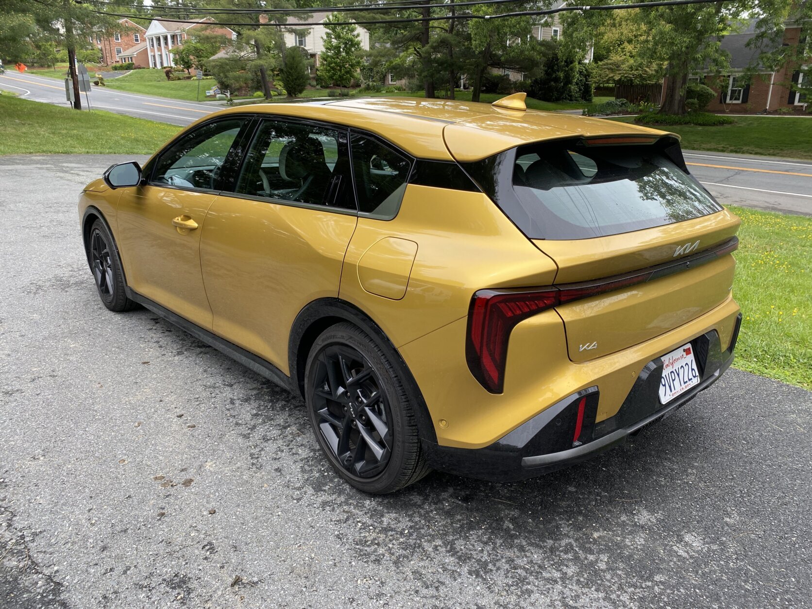 Yellow Kia car.