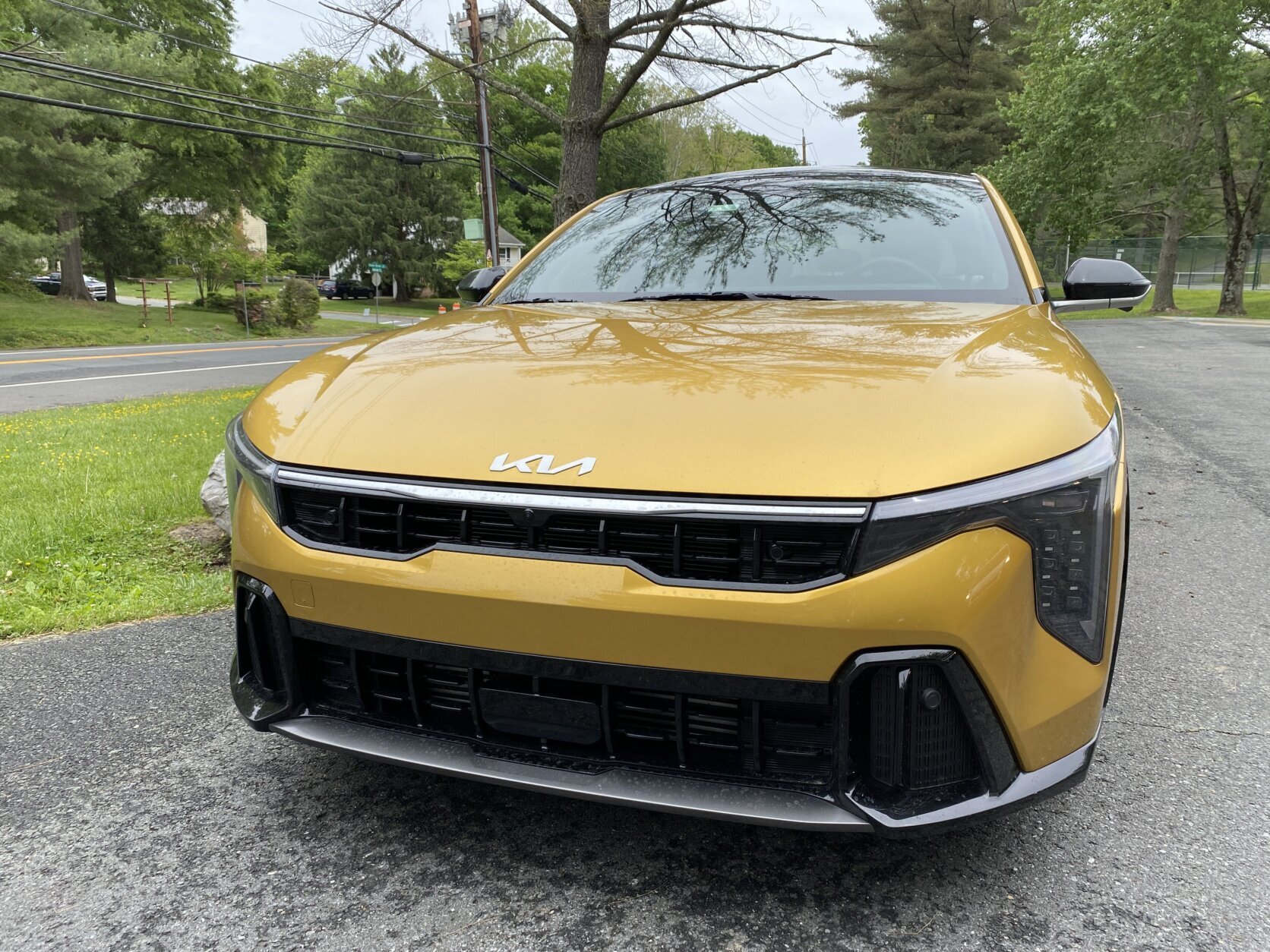 Yellow Kia car.