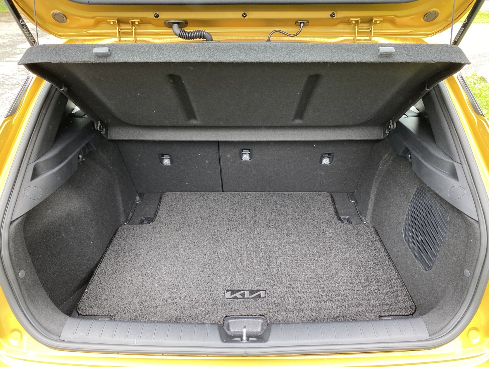 Yellow Kia car.