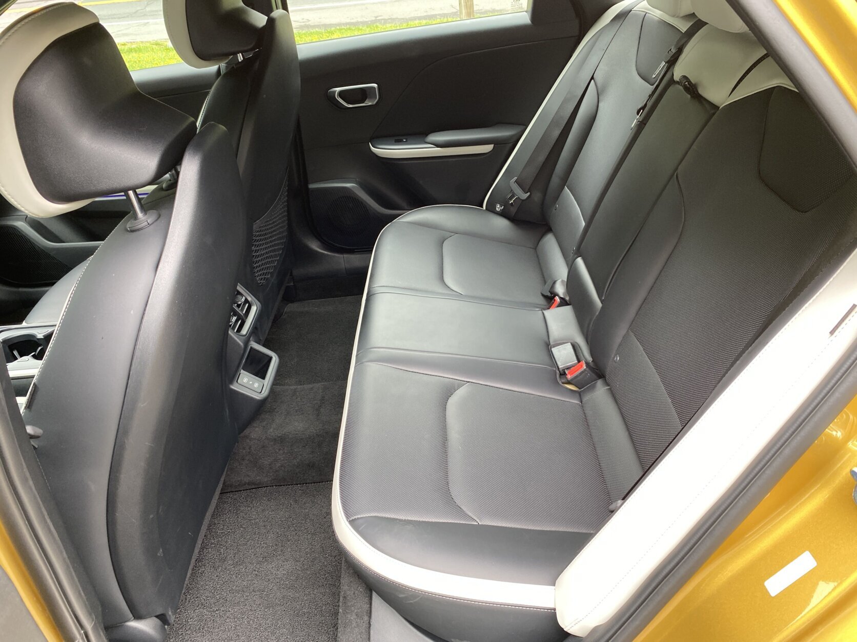 Yellow Kia car.
