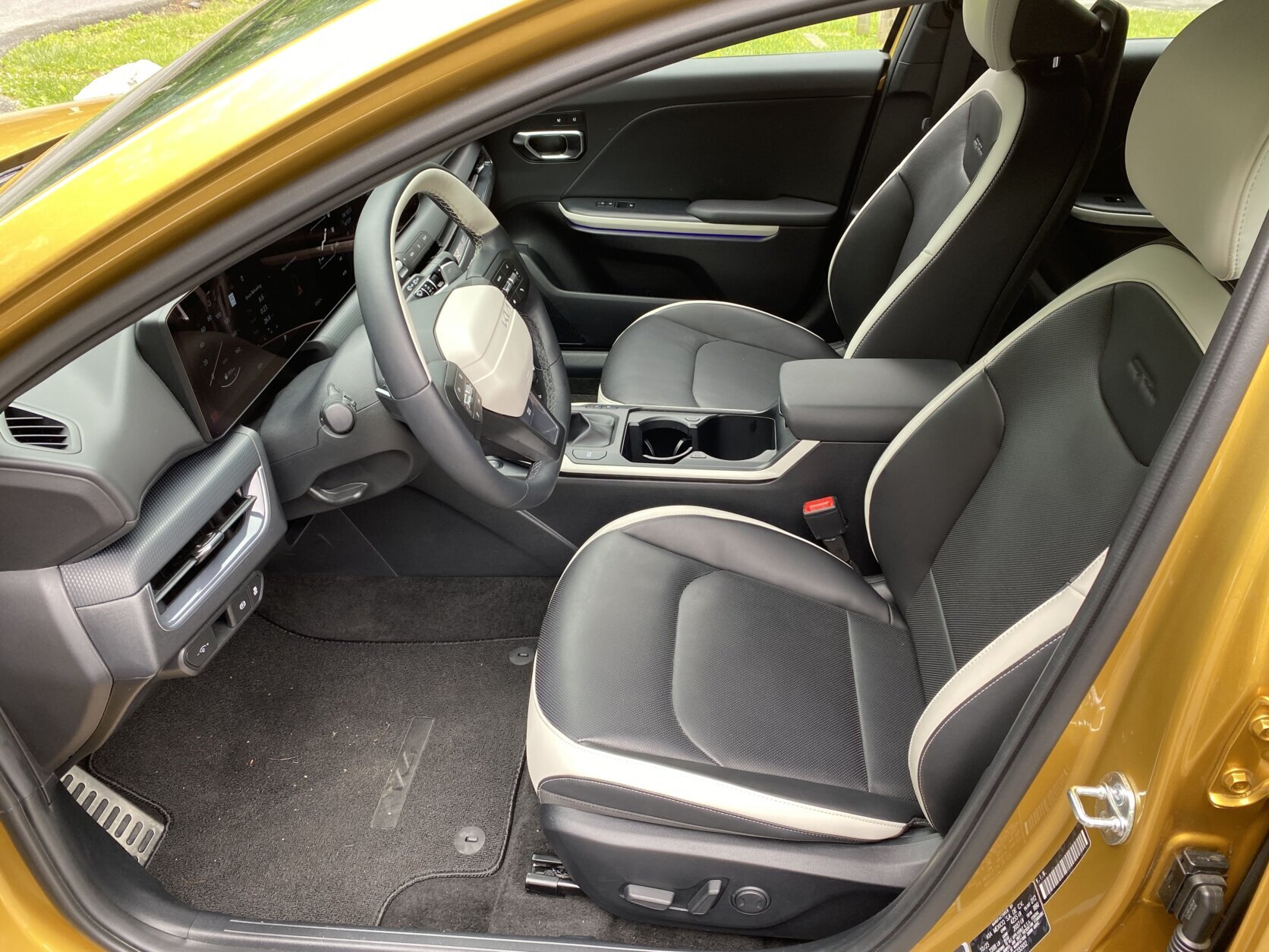 Yellow Kia car.