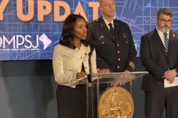 a woman speaking at a podium