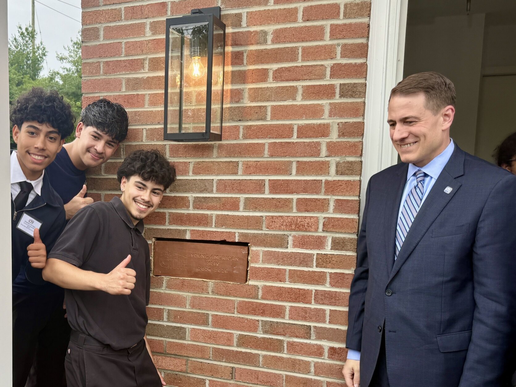 Students with CTF pose with Montgomery County Public Schools Superintendent Thomas Taylor.