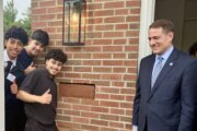 Students with CTF pose with Montgomery County Public Schools Superintendent Thomas Taylor.