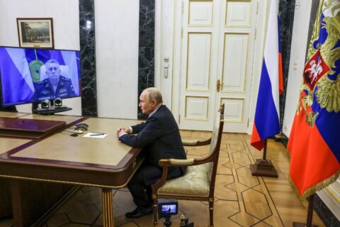 Putin hails Russia’s test launch of a new ballistic missile and calls it the world’s most powerful