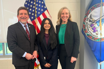 teenage girl with two Virginia officials