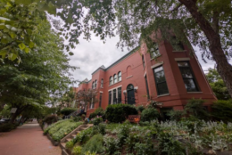 DC home with red brick and black rimmed windows