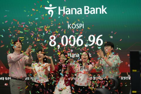Asian stocks are lower after South Korea’s Kospi hits records, as Trump wraps up Beijing trip