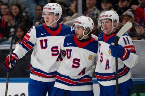Defending champs US rebounds from a loss to Switzerland by beating Britain 5-1 at ice hockey worlds