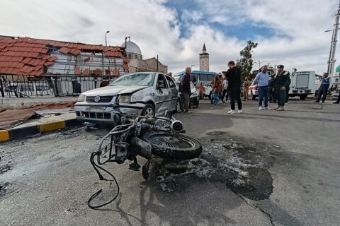 Blast outside a Syrian defense ministry building kills a soldier, wounds 12 people