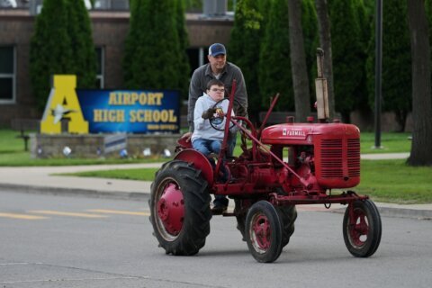 Tractors, ATVs and golf carts, oh my: Michigan seniors arrive at school in style on Tractor Day