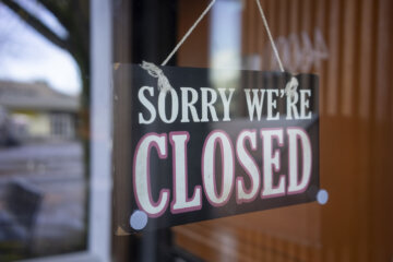 sign hanging outside business says close