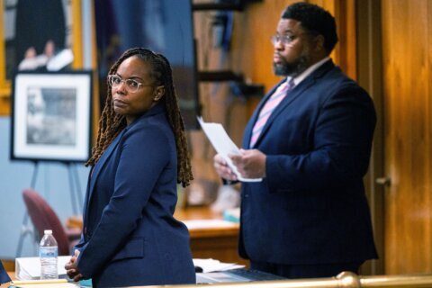 Judge dismisses charges against school official accused of ignoring warnings of gun before shooting