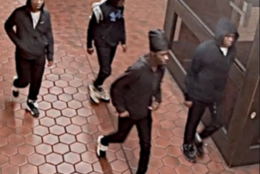 young men walking in group in metro station