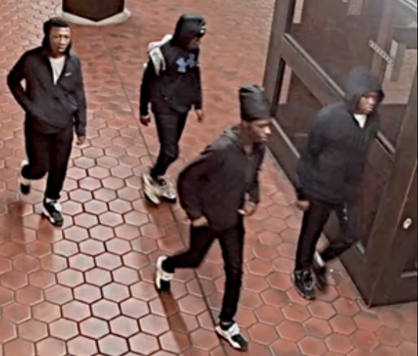 young men walking in group in metro station