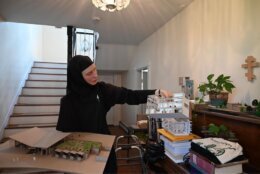 sister nina with models of designs on table