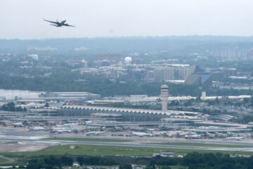 A United jet takes off from Reagan National Airport as seen from the Washington Monument, Tuesday, May 26, 2026, in Washington. (AP Photo/Mark Schiefelbein)