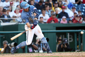 Washington Nationals' Curtis Mead hits an RBI double during the eighth inning of a baseball game against the San Diego Padres, Saturday, May 30, 2026, in Washington. (AP Photo/Daniel Kucin Jr.)