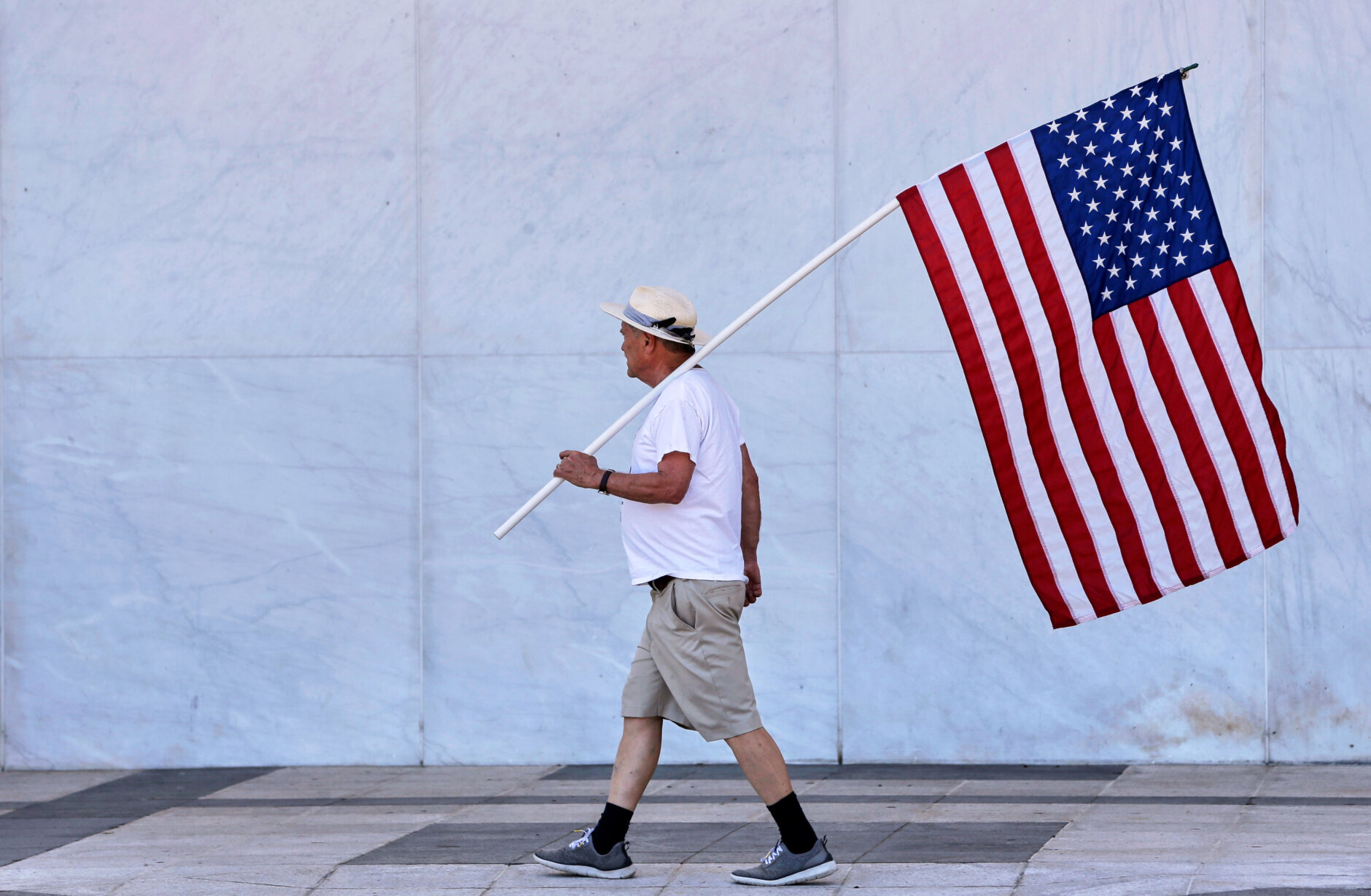 A man holds American flag