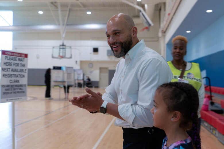 D.C. Council member Robert White Jr., greets supporters as he arrives to cast his vote during the D.C. primary election at Shepard Park Elementary, Tuesday, June 16, 2026, in Washington. (AP Photo/Jose Luis Magana)
