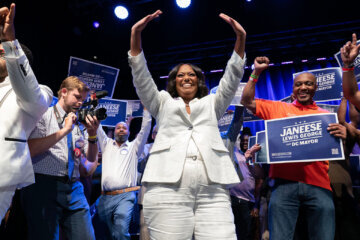 D.C. Council members Janeese Lewis George wave to the crowd as she celebrates after winning D.C. Mayor Democratic primary election during the Election Night Party at the Howard Theatre Tuesday, June 16, 2026, in Washington. (AP Photo/Jose Luis Magana)