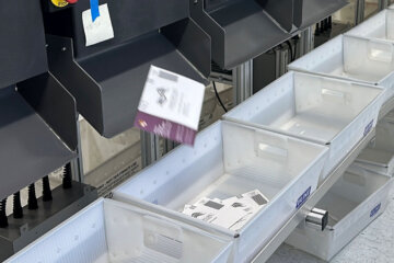 A sorting machine separates sample ballots.