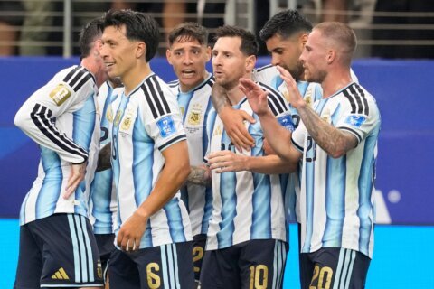 Messi sets World Cup scoring record as defending champion Argentina advances to knockout stage