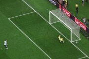 Austria goalkeeper Alexander Schlager dives for the soccer ball.