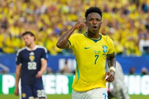 Vinícius Júnior scores 2 goals as Brazil beats Scotland 3-0 to win its World Cup group