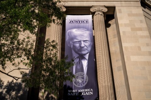 The Latest: Trump keeps immunity from tax probes while scrapping $1.8 billion compensation fund