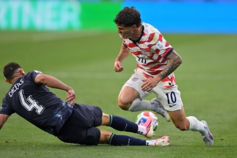 US forward Christian Pulisic practices on his own in calf injury rehab, team says he is ‘day to day’
