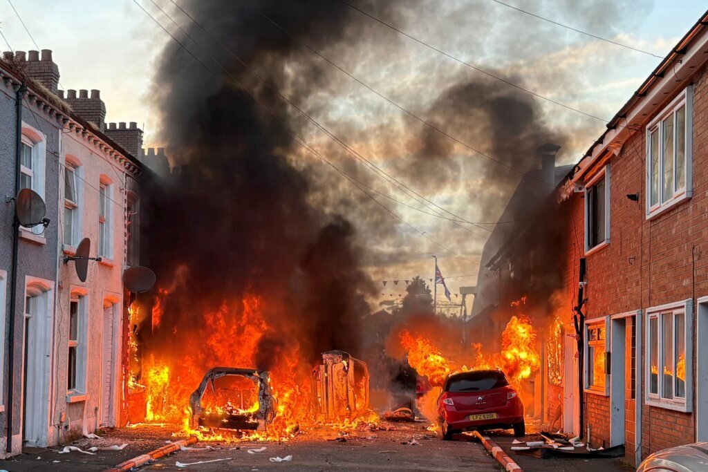 Police blast water cannons at Belfast protesters as unrest flares again after stabbing