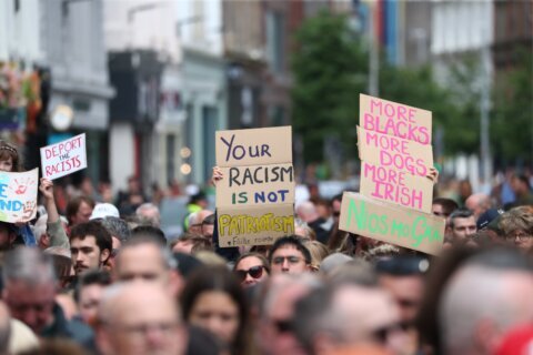 Thousands rally in Belfast to condemn anti-immigrant rioting that followed stabbing