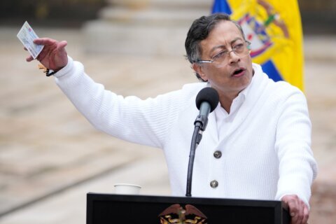 About 100 Colombian guerrilla dissidents disarm under peace talks with government