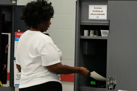 Georgia’s QR codes for counting votes will remain for midterms after lawmakers vote to delay a fix