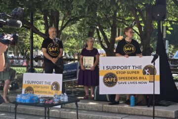 Advocates with Families for Safe Streets at an Arlington, Virginia, event marking the state's new law allowing judges to require speed-limiting devices in vehicles driven by convicted reckless drivers.