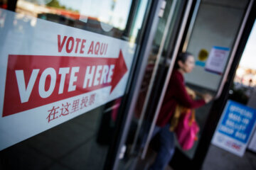 A woman leaves the polling place at the Cleveland Park Public Library
