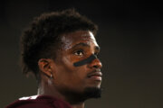 football player face from side pictured close up
