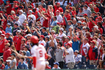 Fans cheer as CJ Abrams (5) of the Washington Nationals hits a three-run home run