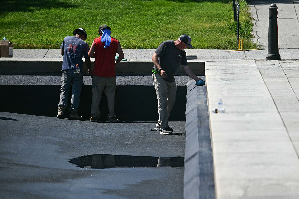 Contractors continue work on the Reflecting Pool on the National Mall