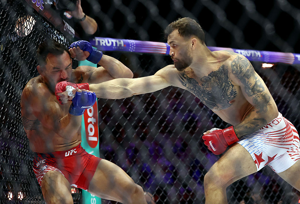 Mauricio Ruffy lands a punch on Michael Chandler